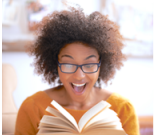 surprised and happy teen reading a book