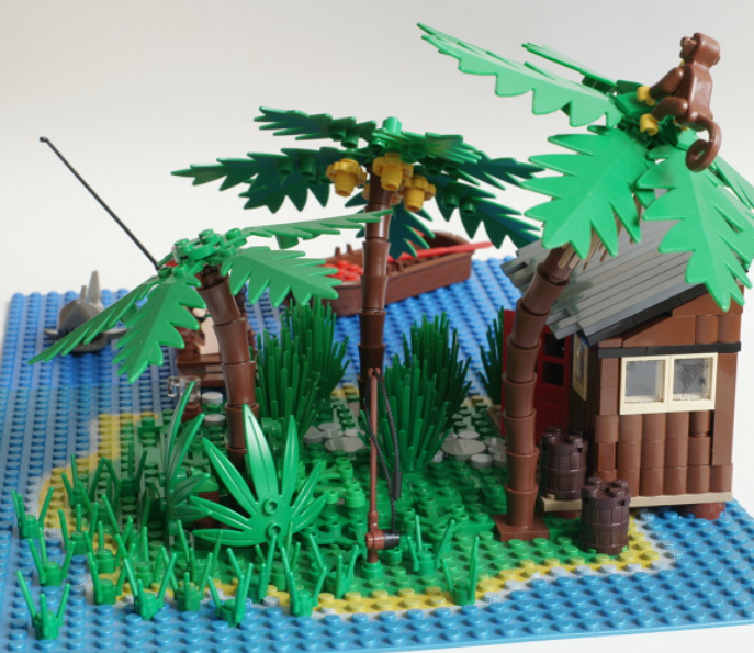 tropical island built with lego bricks with a monkey in the palm tree
