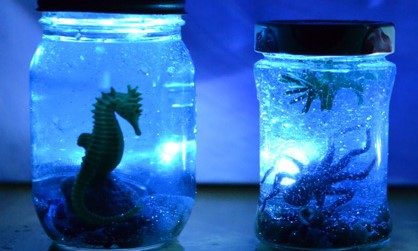 ocean creatures in a mason jar with a light inside