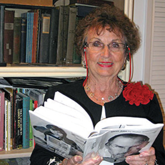 photo of author marjory lyons with open book