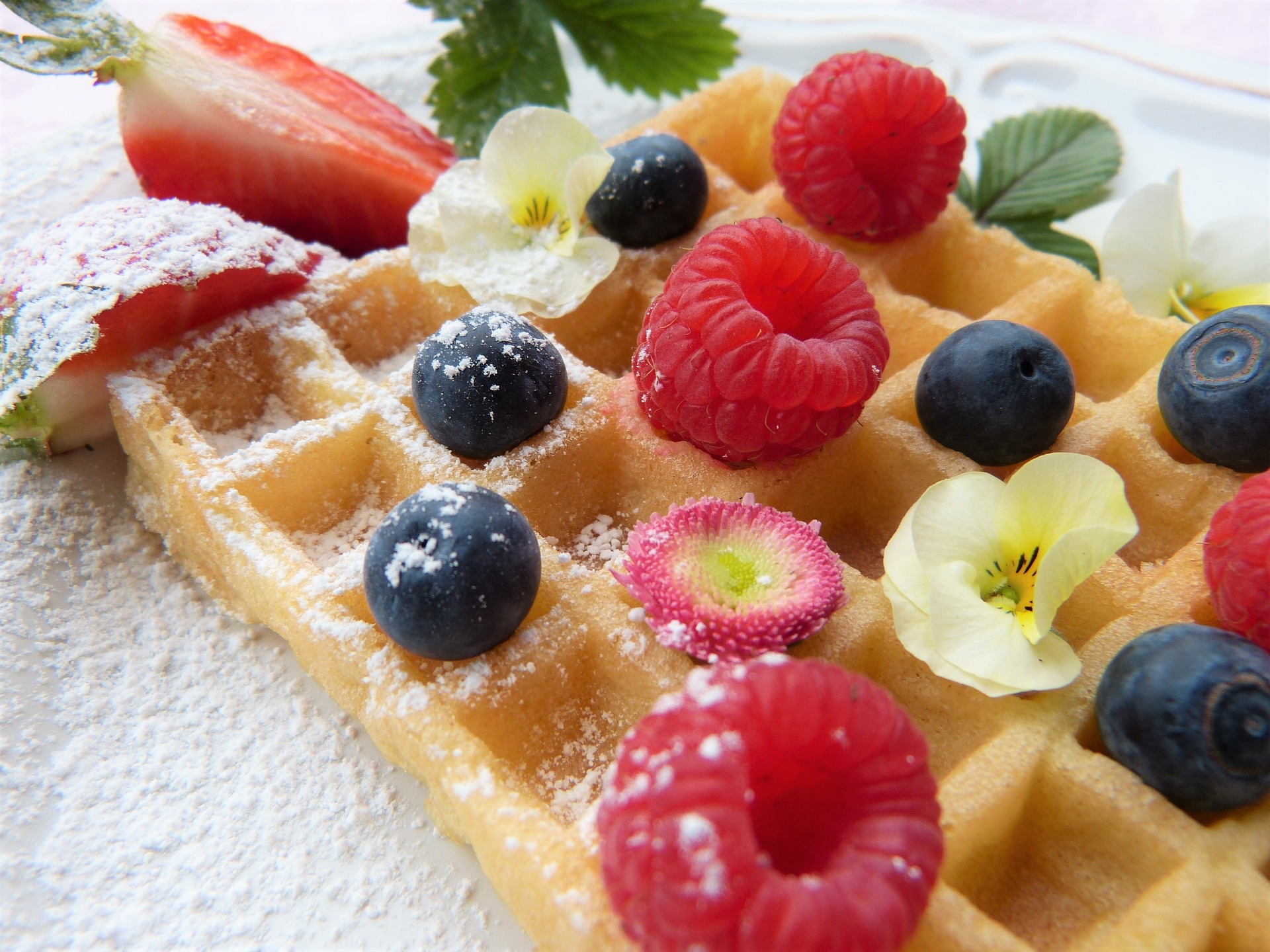 waffle topped with blueberries and raspberries