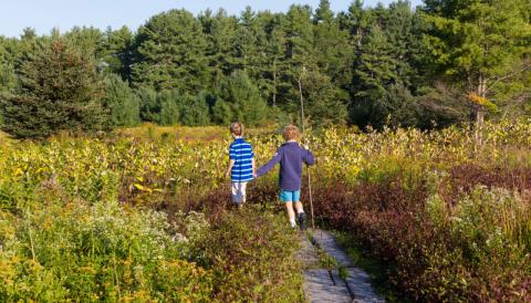 children walking along a path highland farm preserve
