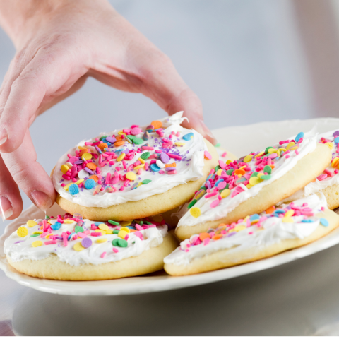 circle sugar cookies covered with sprinkles