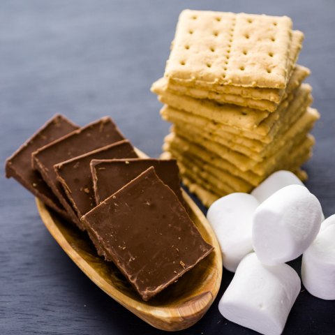 chocolate bars, marshmallows and a stack of graham crackers