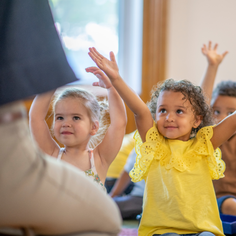 preschoolers listening to stories and songs