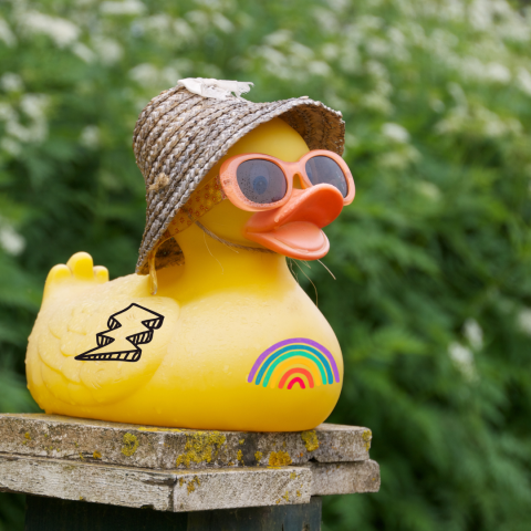 Rubber duck in a hat with sunglasses and tattoos