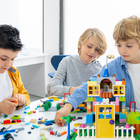 kids building with legos