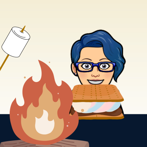 danie by a campfire eating a s'mores