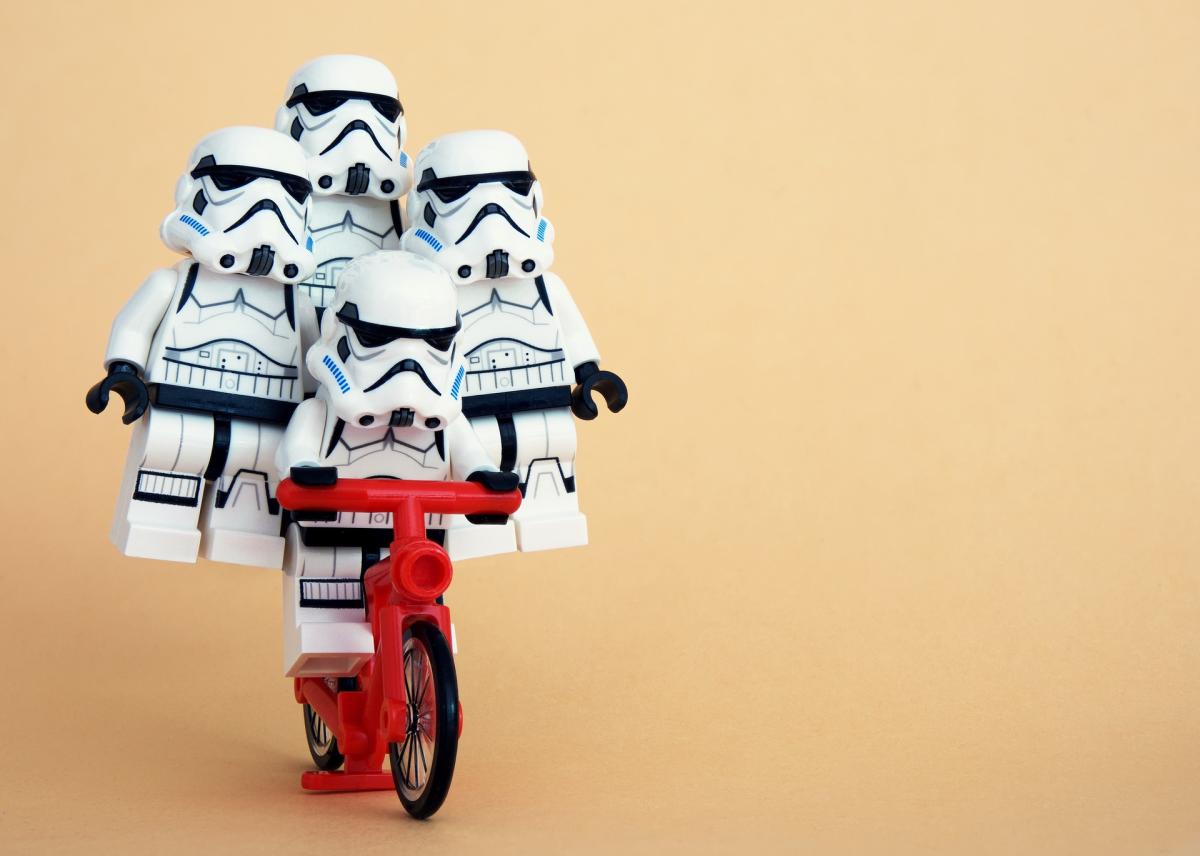 Lego storm troopers riding a lego bicycle