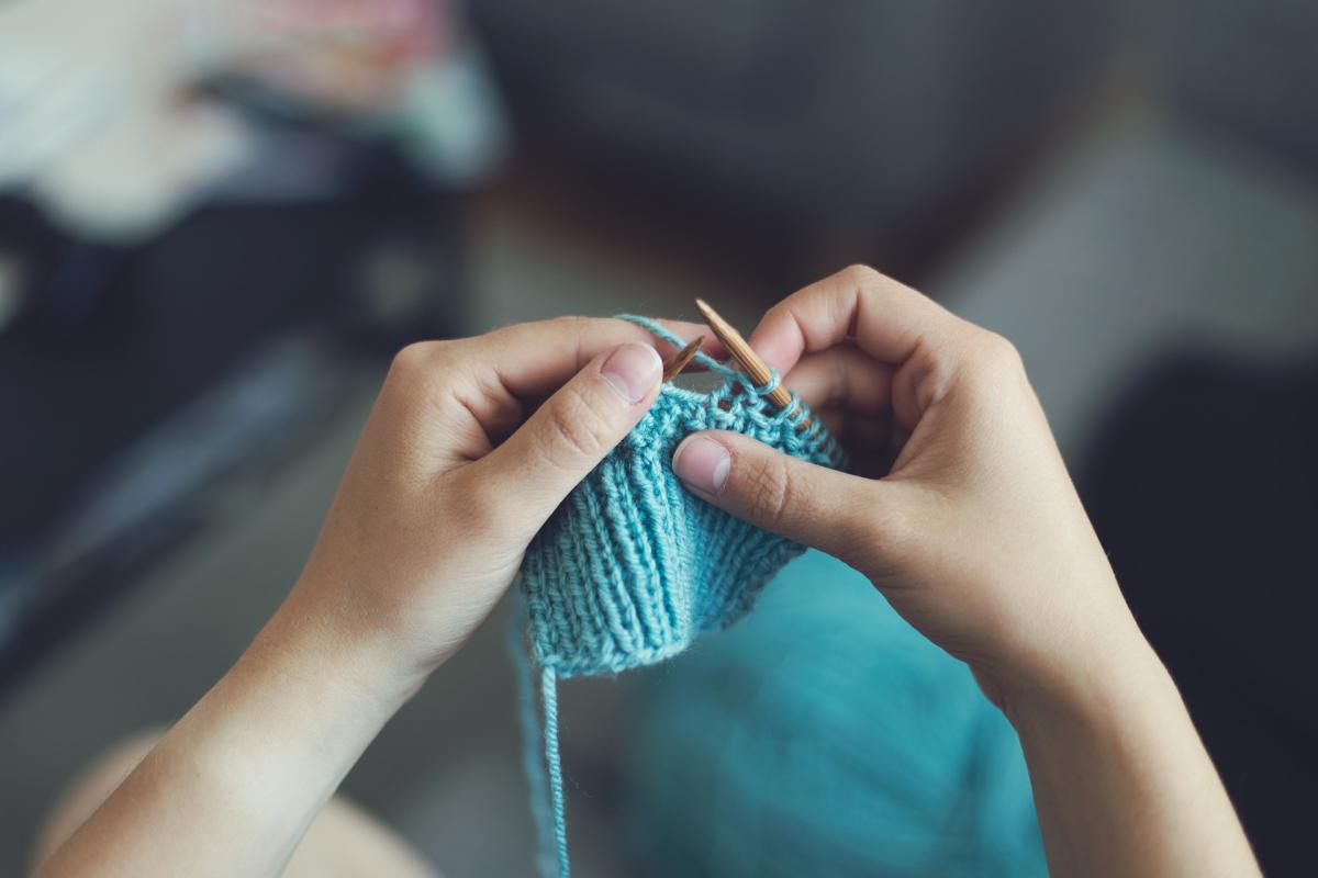 person knitting