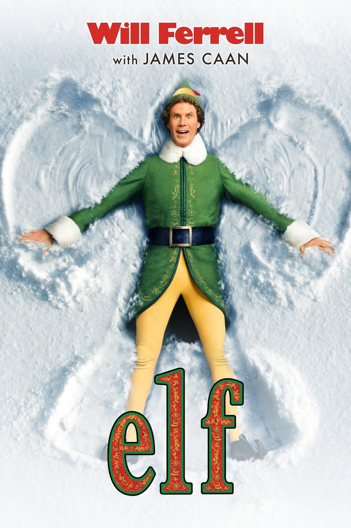 man dressed as an elf making a snow angel