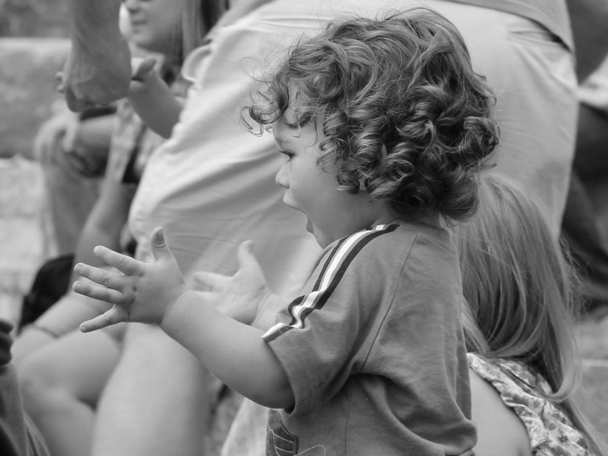 child clapping and dancing