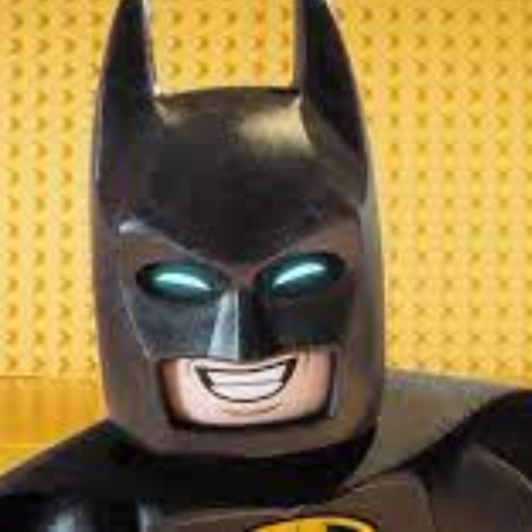 lego batman on a yellow lego background. He is smiling.