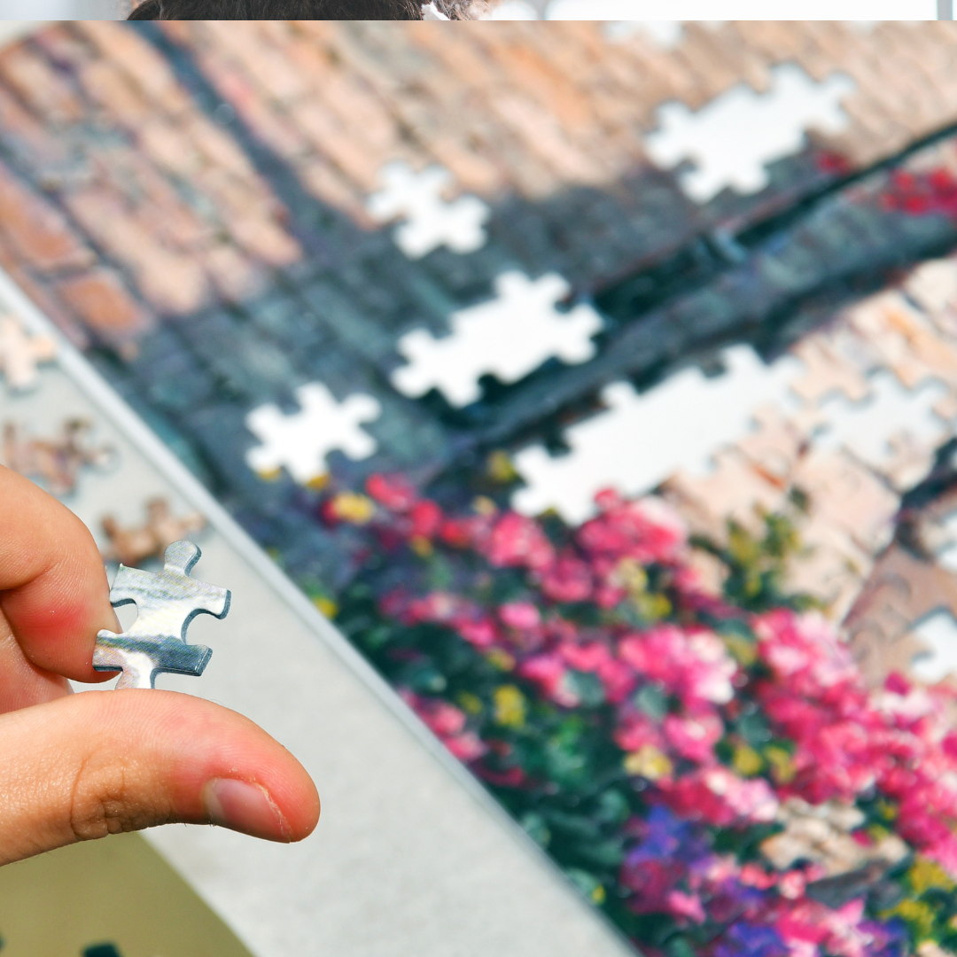 a person putting together a puzzle