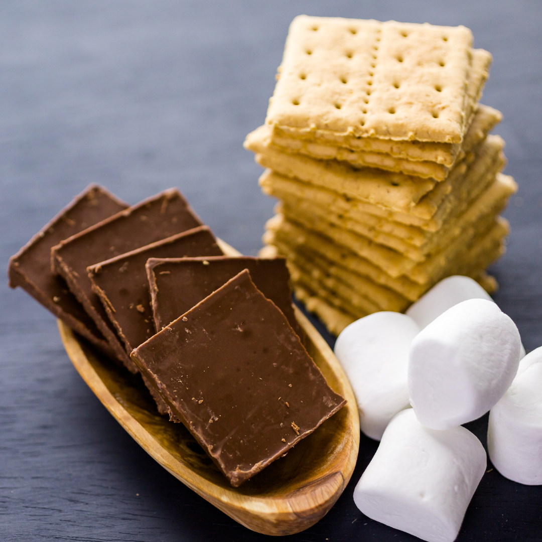 chocolate bars, marshmallows and a stack of graham crackers