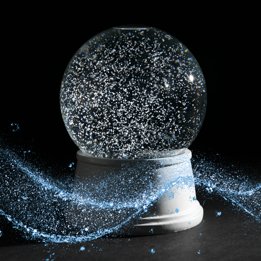 snow globe with a wave of blue glitter